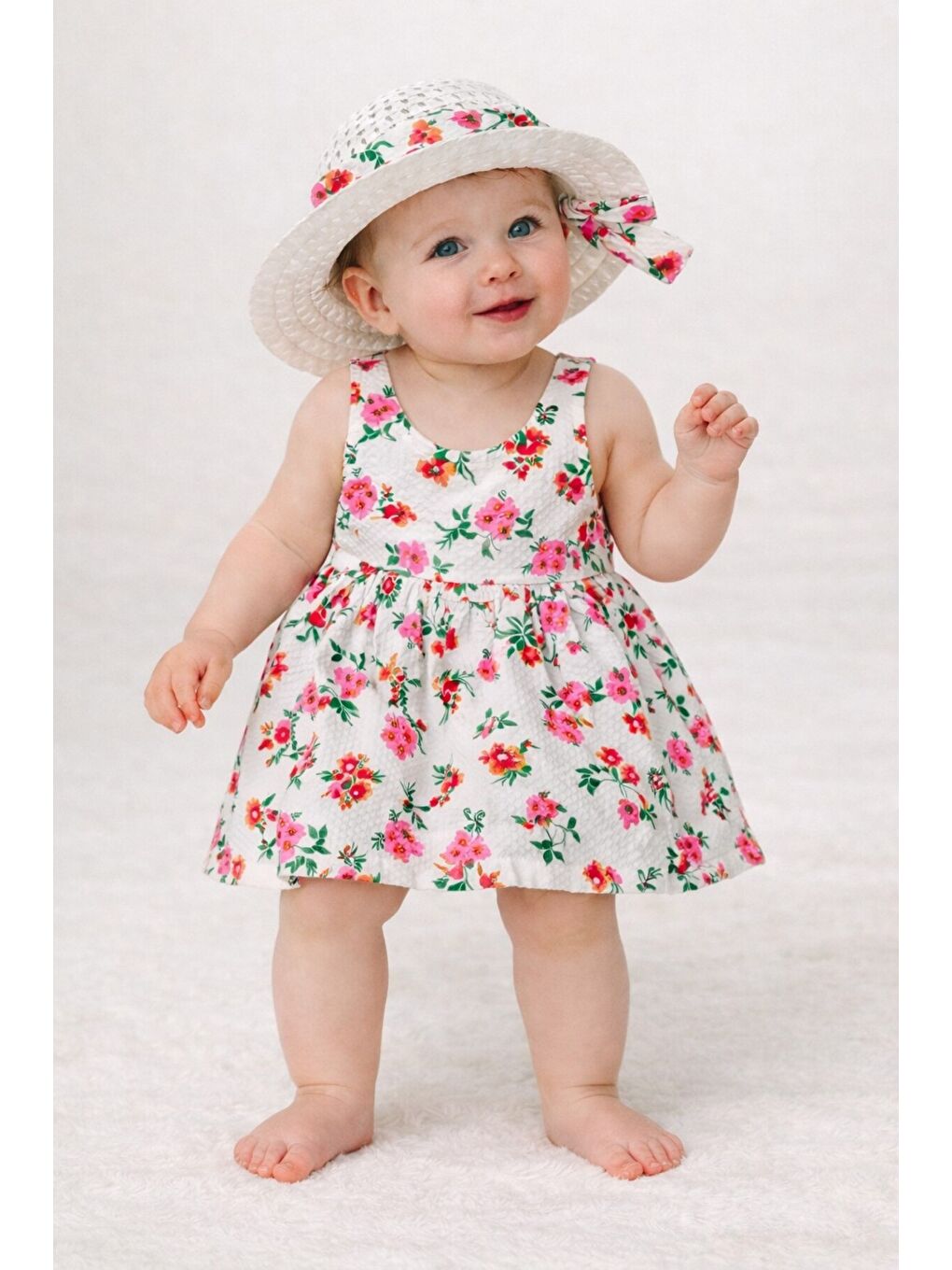 Pembe Çiçek Desenli Şapkalı Fiyonklu Kız Bebek Elbisesi