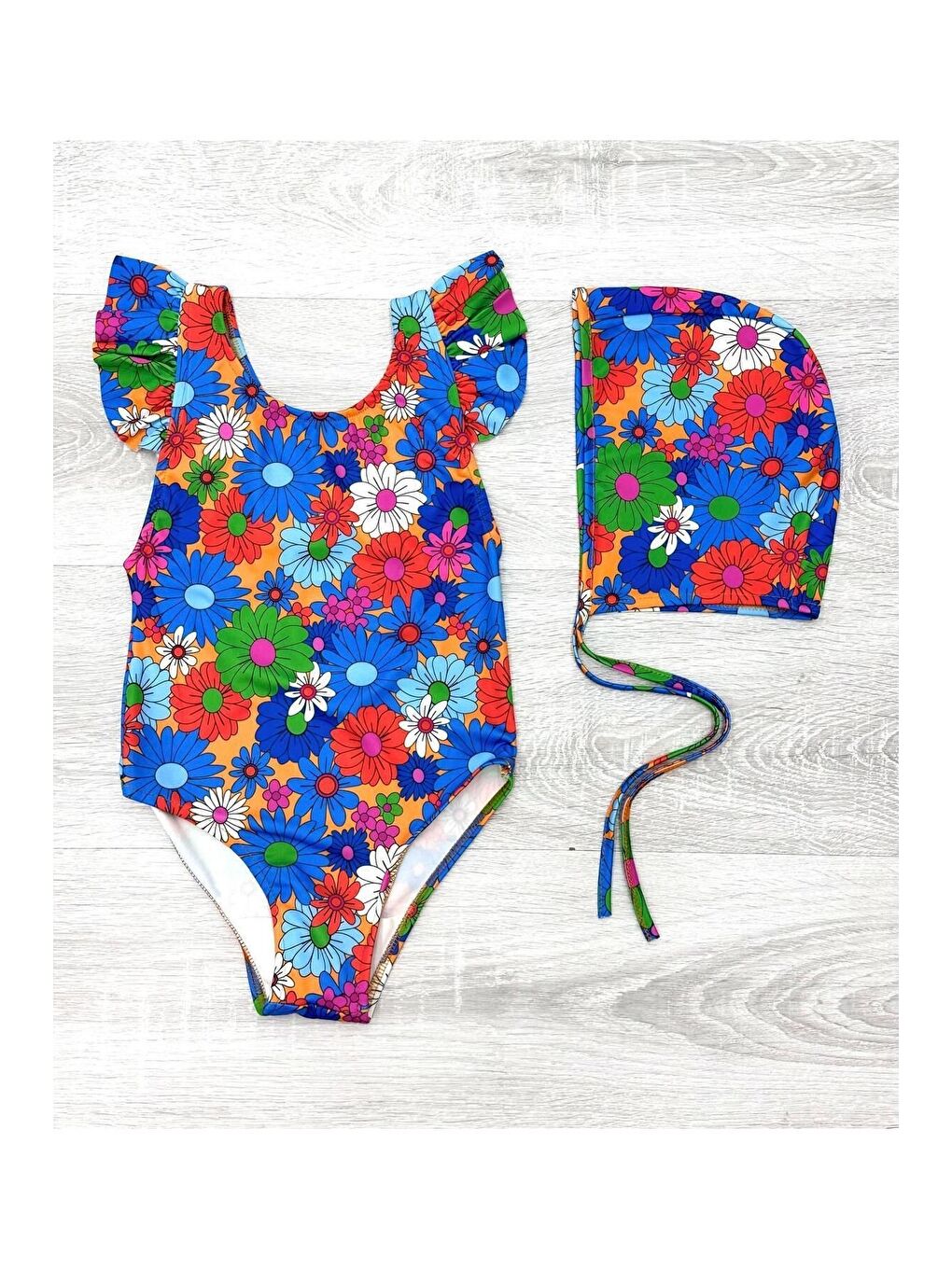 Mavi Sırttan Çapraz Fırfır Detaylı Boneli Kız Çocuk Mayo