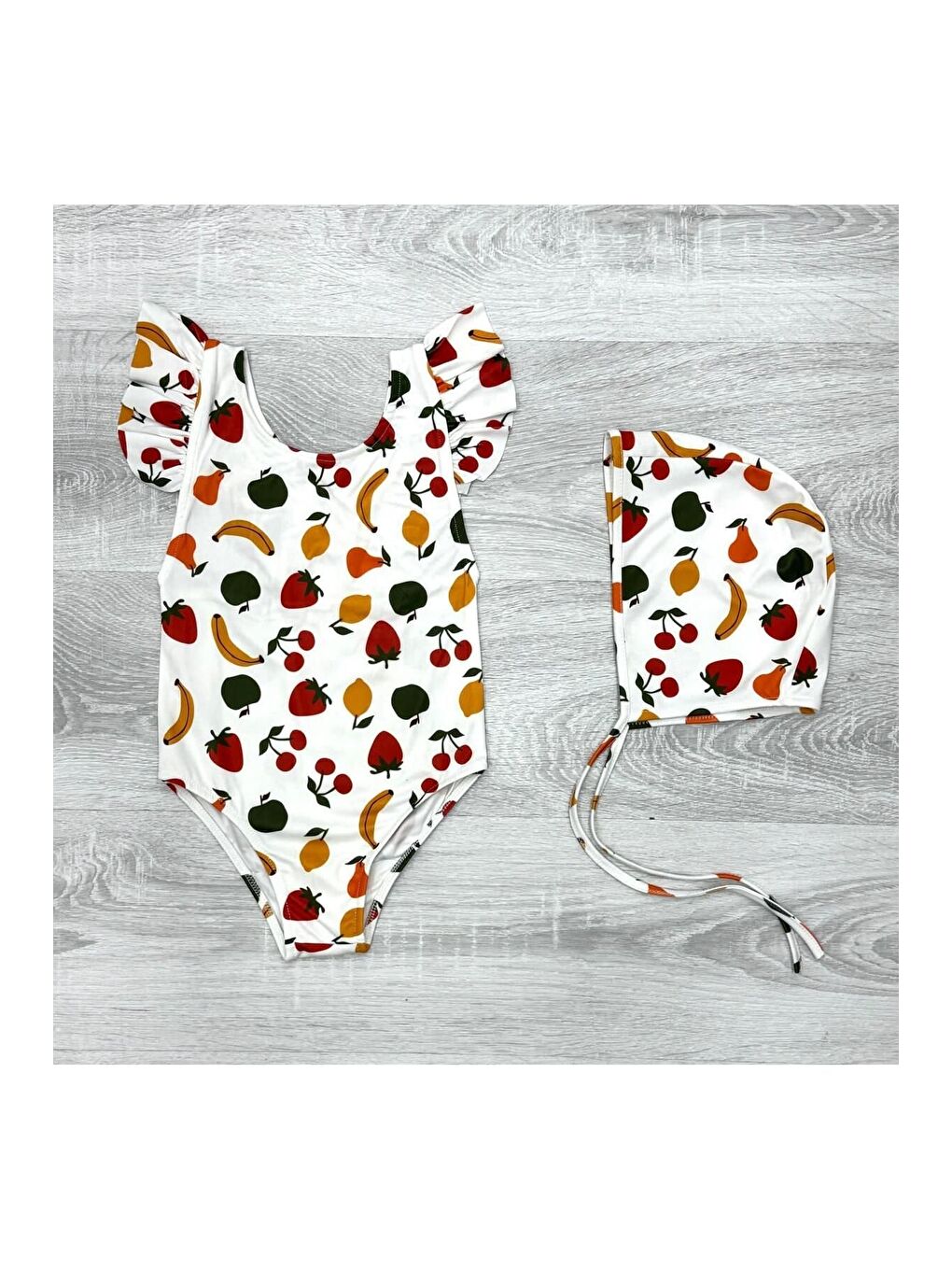 Beyaz Sırttan Çapraz Fırfır Detaylı Boneli Kız Çocuk Mayo