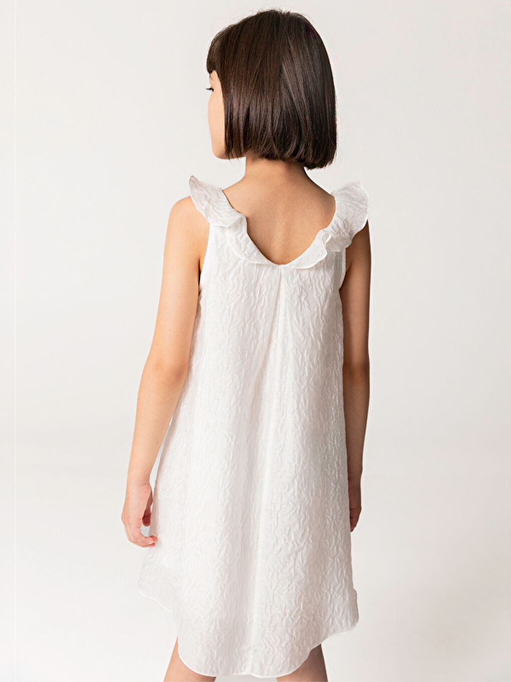 Fırfırlı Beyaz Kolsuz Kız Çocuk Elbise-1