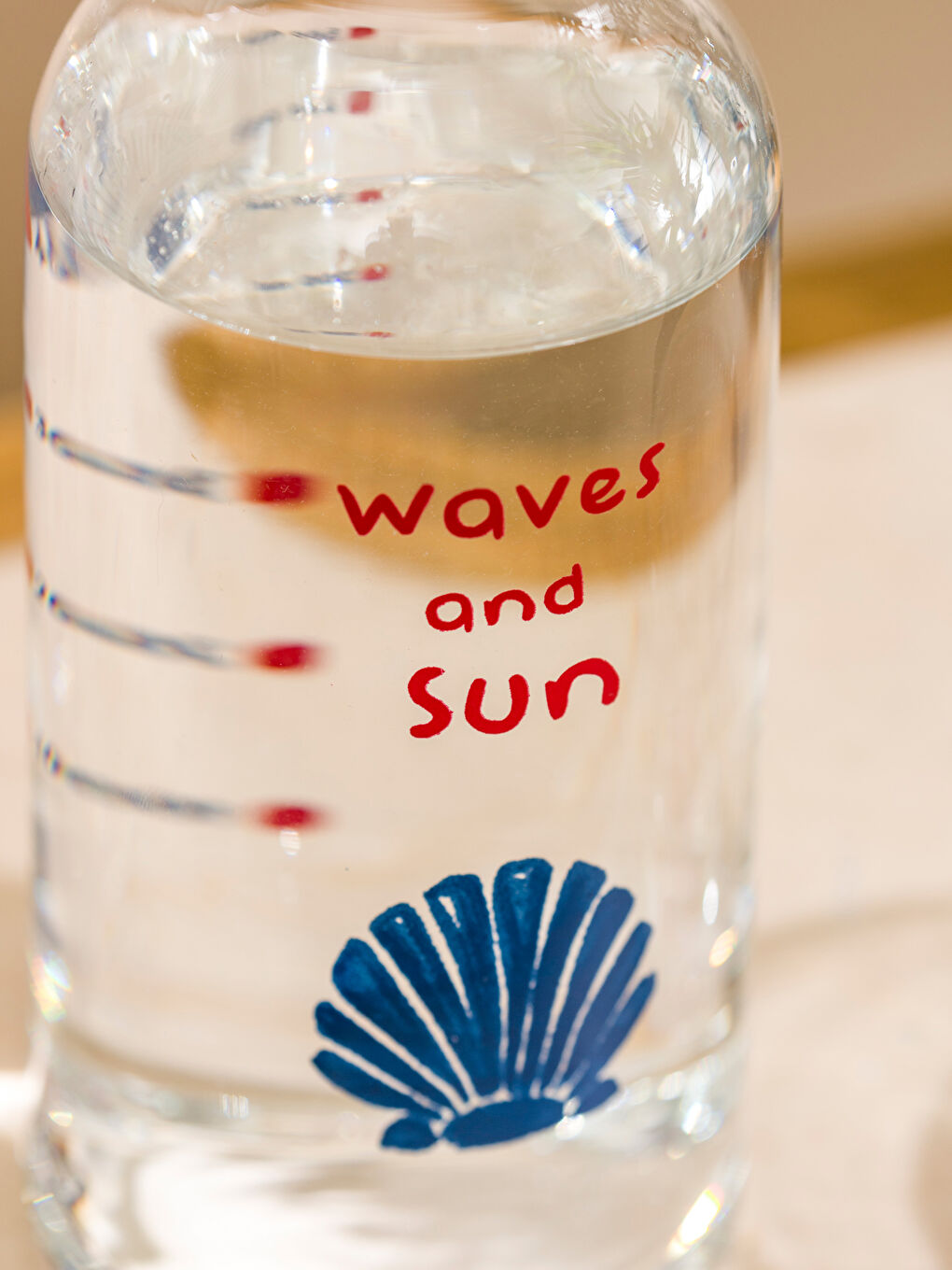 Теңіз қабыршағы бейнеленген шыны су құманы 700 мл-4