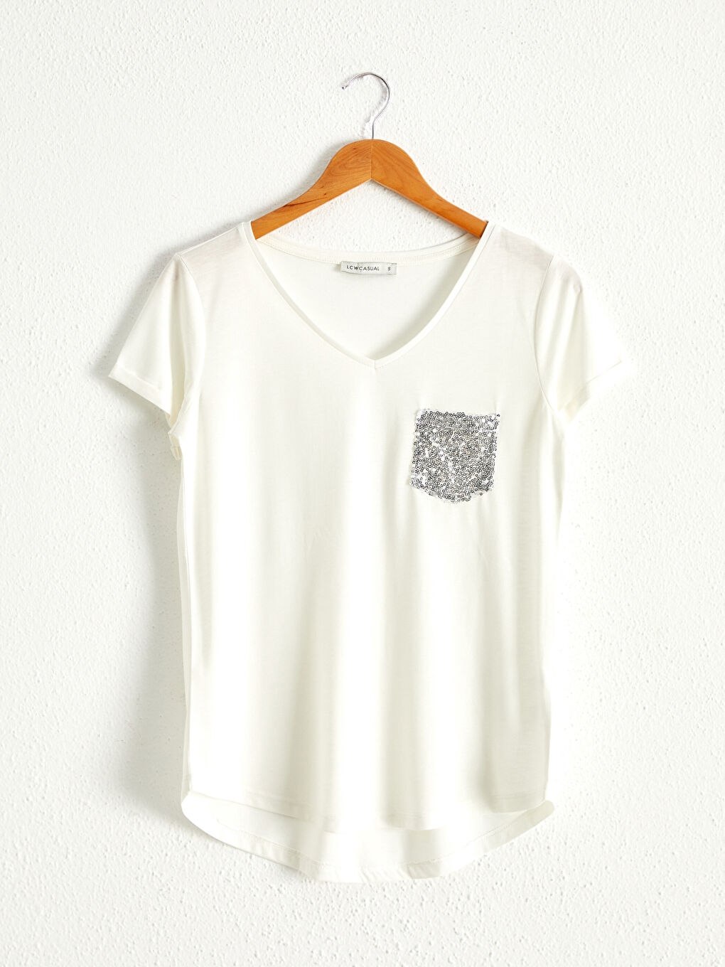 Футболка з кишенею, прикрашеною блискітками