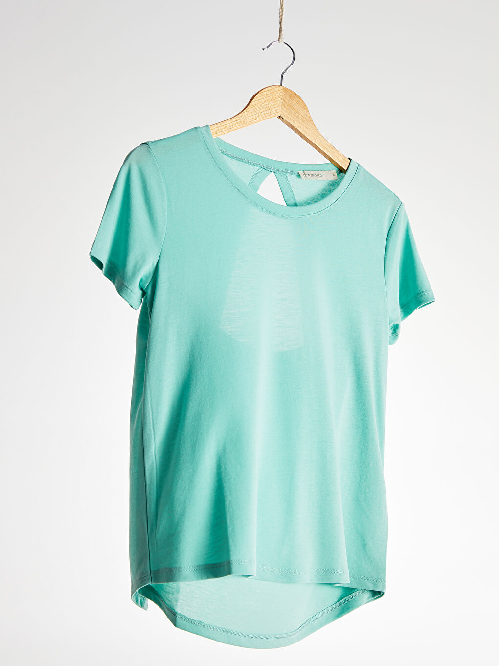 تیشێرتی ژنان - قۆڵ كورت - یه‌خه‌ خڕ-1