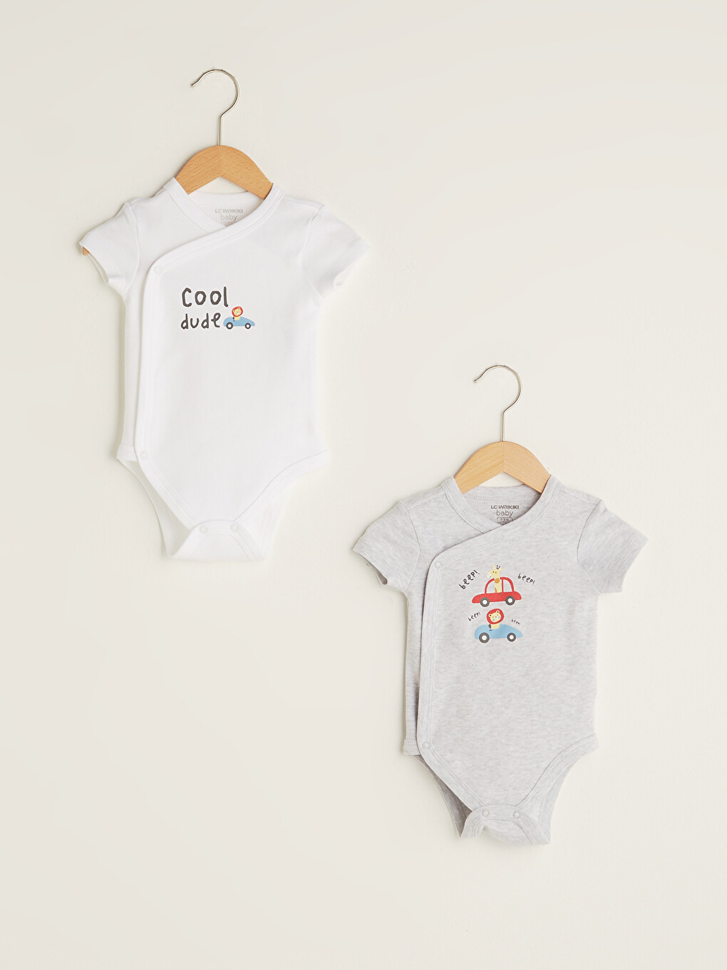 Umschlagkragen Kurzarm Bedruckter Baumwoll-Baby-Jungen-Body mit Druckknopf 2 Stück