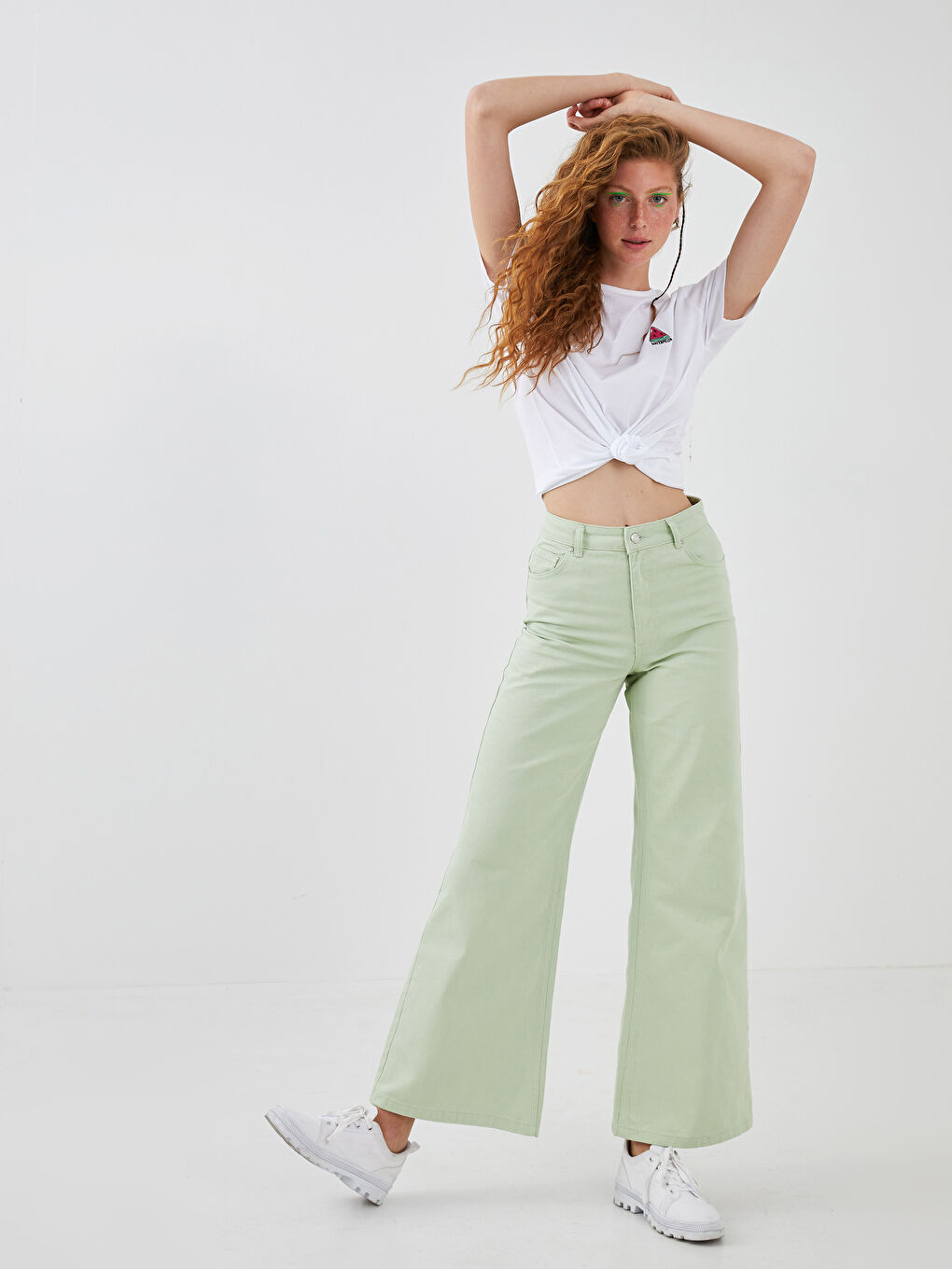 جينز واسع الساق بتفاصيل جيوب للسيدات