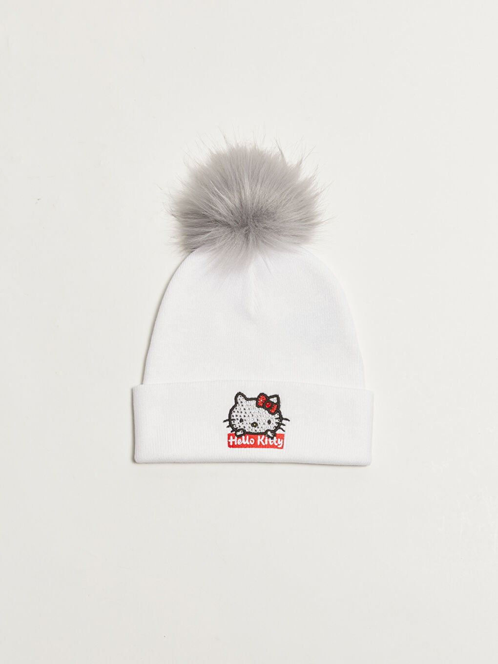 قبعة صغيرة Hello Kitty مطرزة ببومبوم من التريكو للبنات