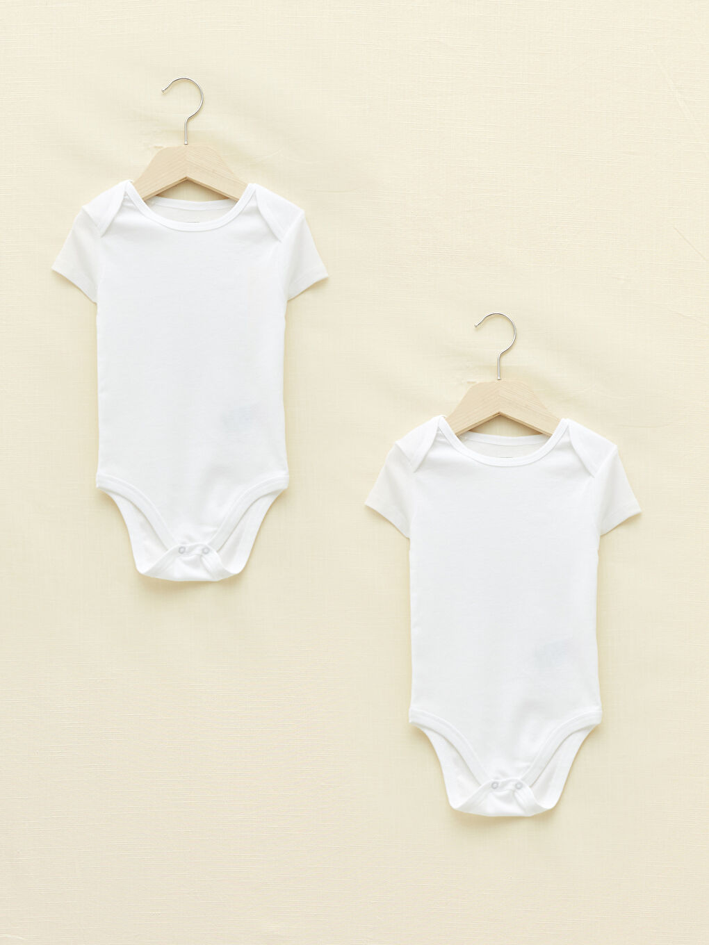 بودي سوت أولادي رضع بأكمام قصيرة وياقة دائرية وكباسين طقطق عبوة من قطعتين