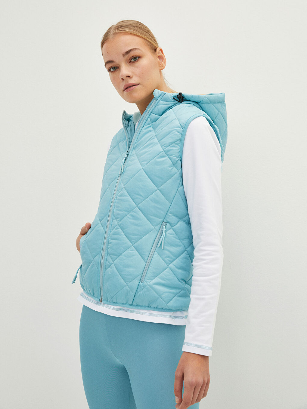 Mavi Kapüşonlu Kapitone Desenli Kadın Yelek