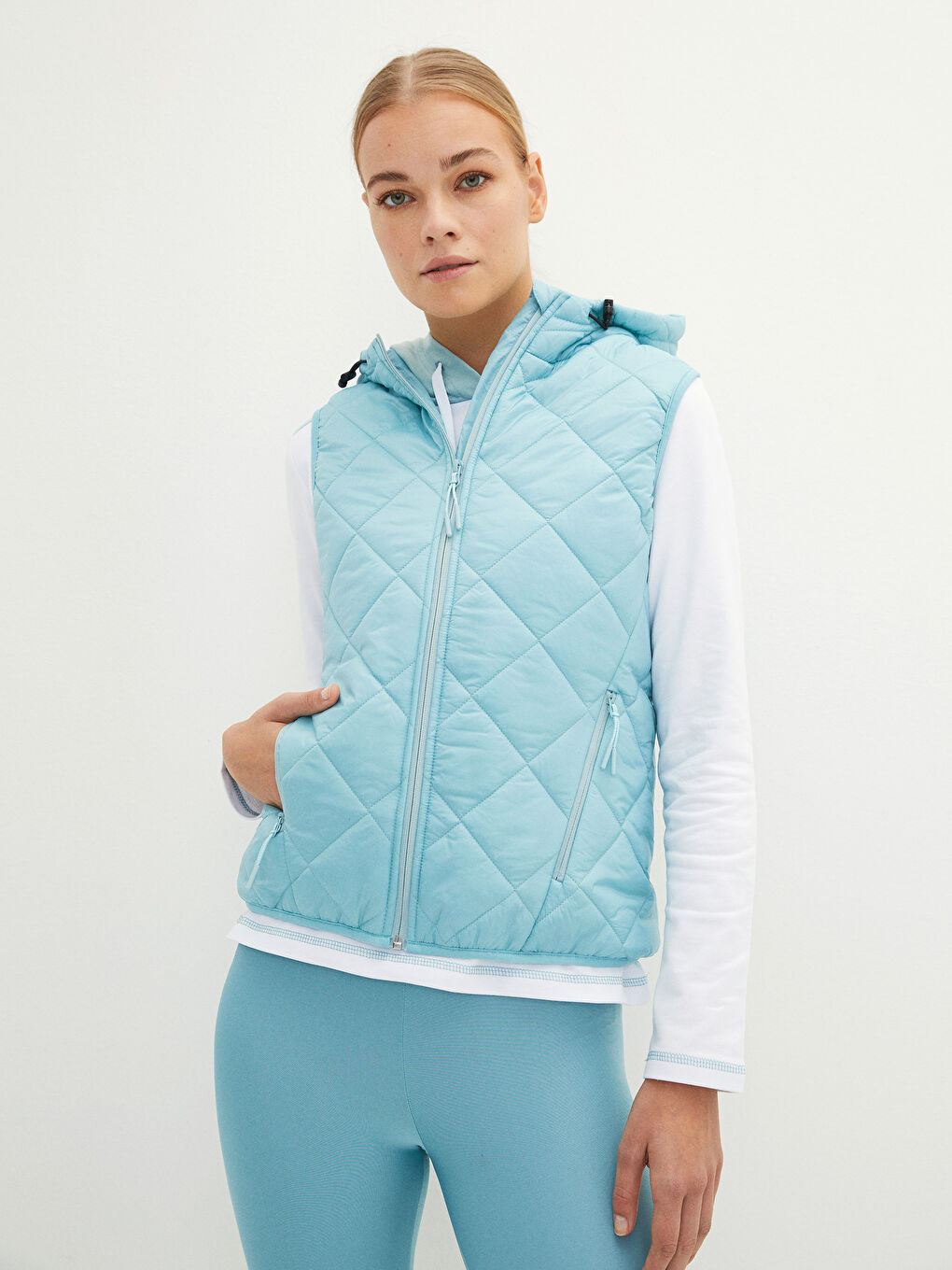 Mavi Kapüşonlu Kapitone Desenli Kadın Yelek-1