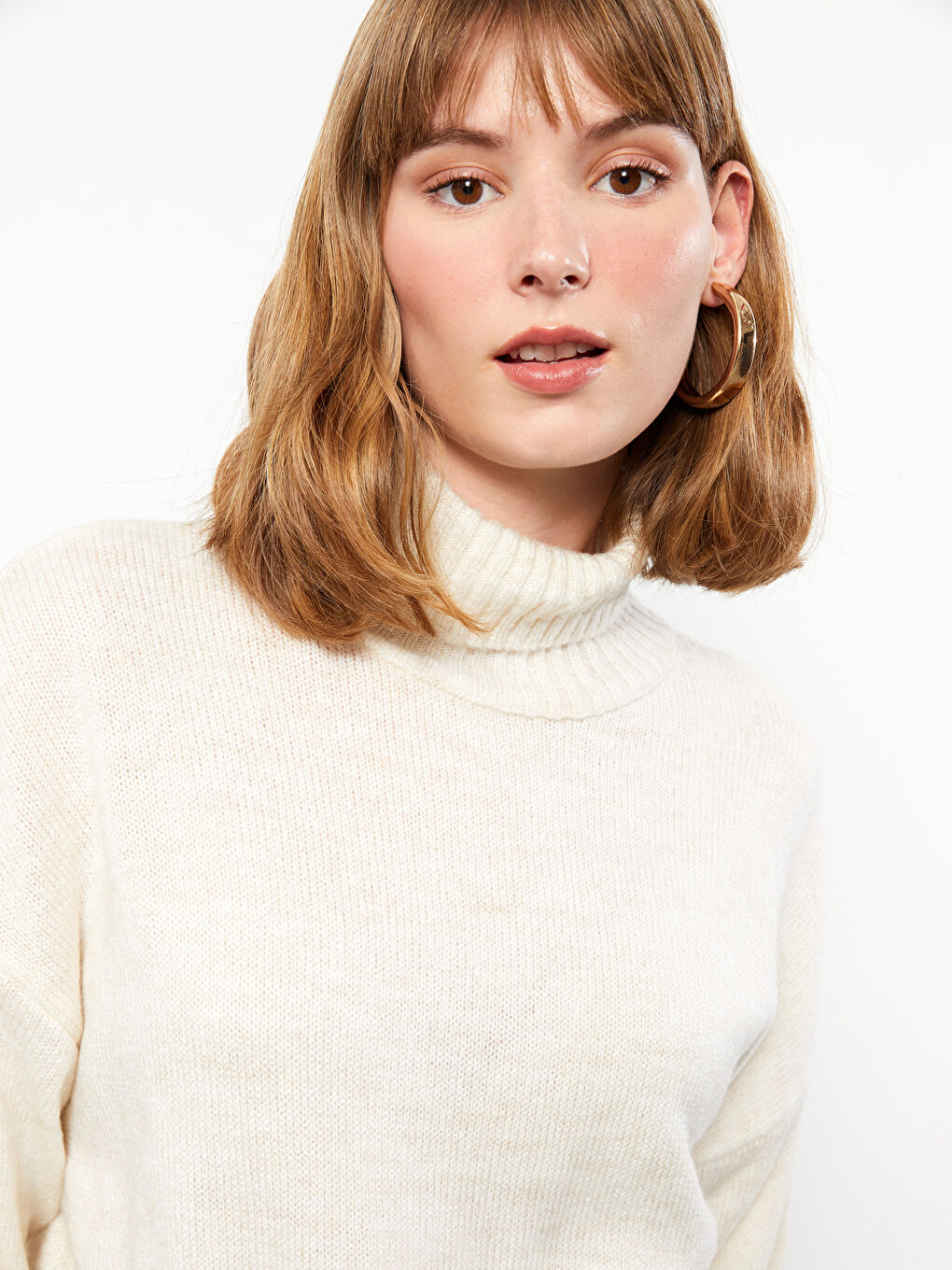 سترة تريكو ياقة هاي نيك سادة كم طويل للسيدات