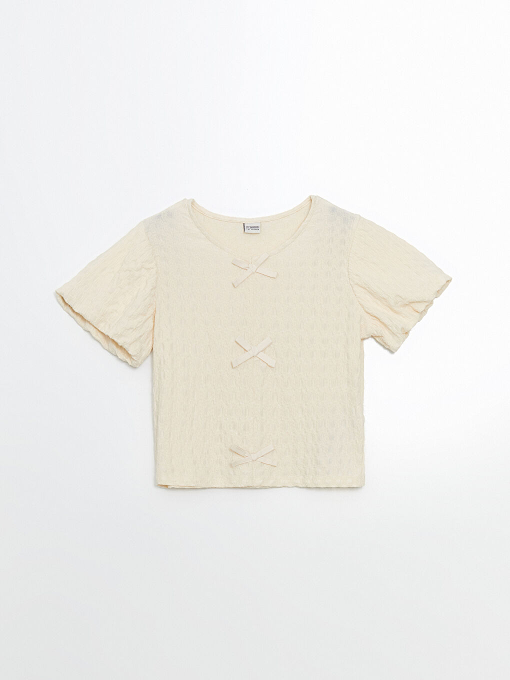 გოგოს მაისური მრგვალი ყელით და ბაფთის დეტალით