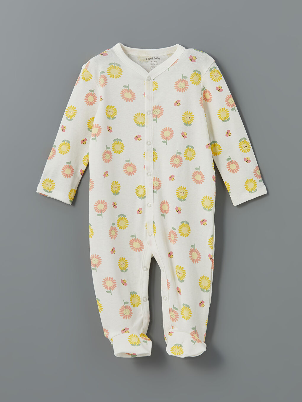 Ekru V Yaka Çiçek Desenli Kız Bebek Tulum