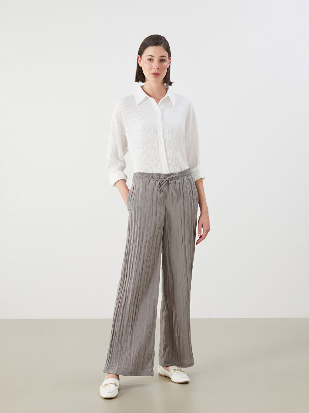 LCWAIKIKI Classic Elasticated Waist Textured Wide Leg Women's Trousers -S5RG04Z8-10O