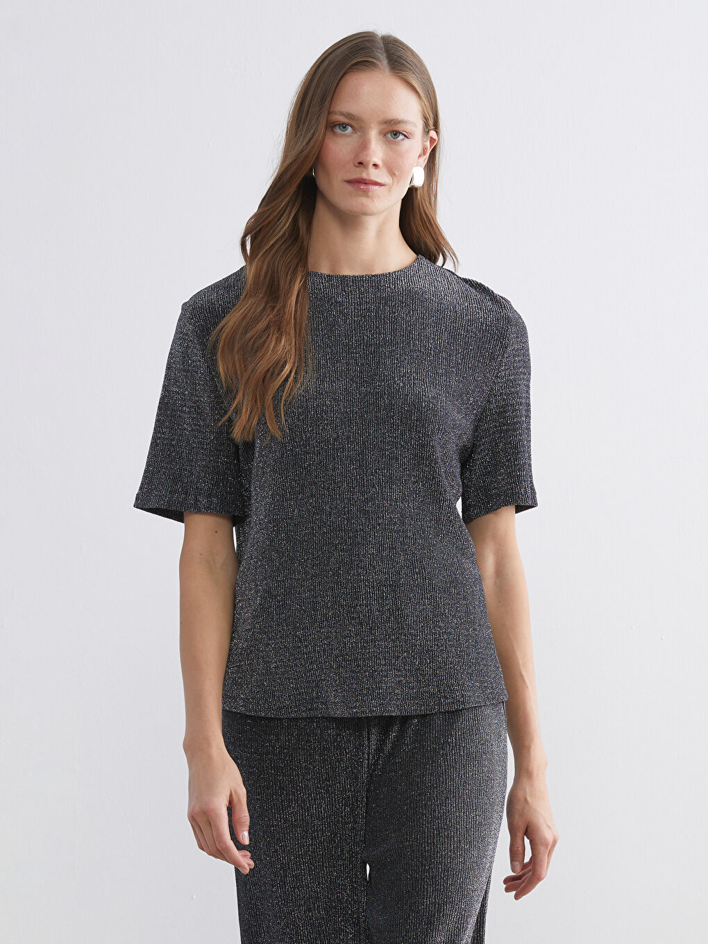 Shine in our crew neck blouse.