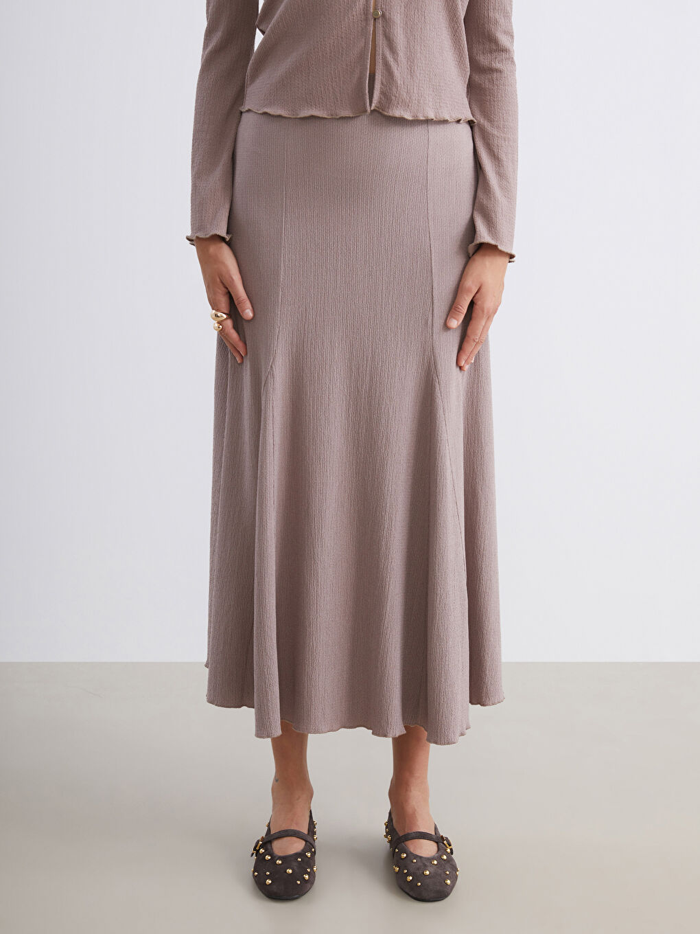 Bej Beli Lastikli Dokulu Pileli Etek-1