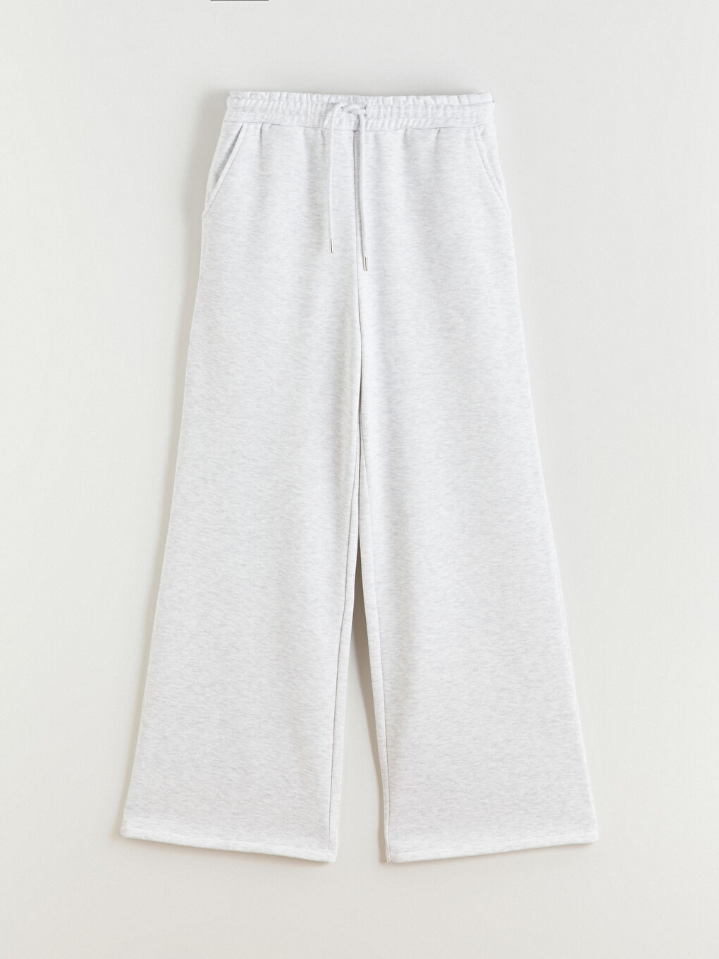 پانتۆڵی ئارەقە بە کەمەر لاستیکی و پانتۆڵ فراوان بۆ ژنان