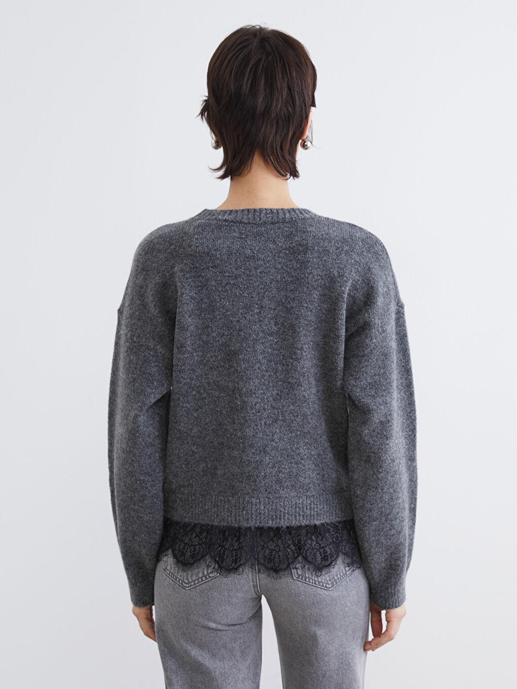 Elevate your style with our crew neck knit sweater, delicately accented with lace.-9