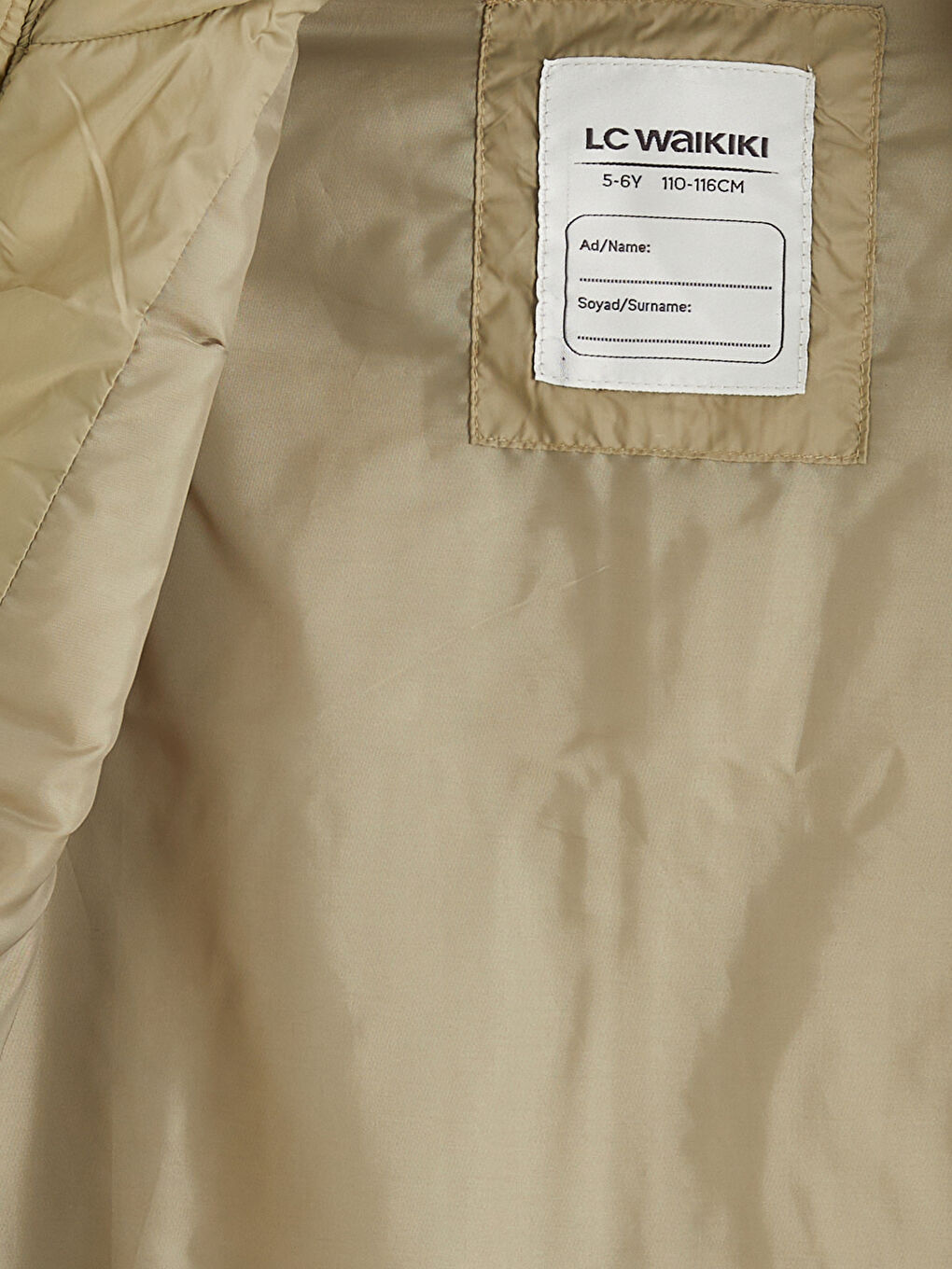 Пухена жилетка за момче с яка тип фуния-1