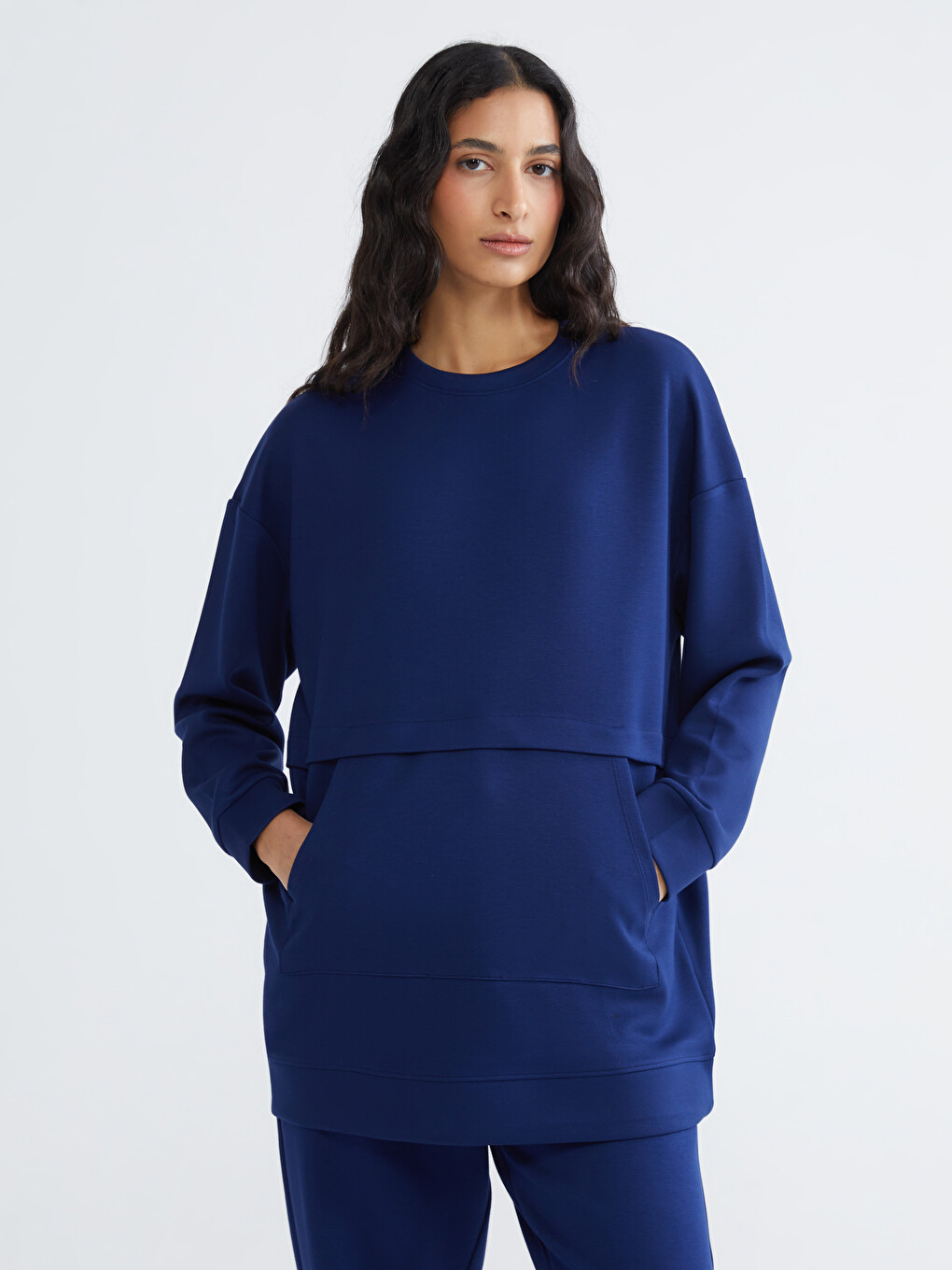 Effortless elegance meets everyday comfort in our soft-touch, crewneck sweatshirt tunic.