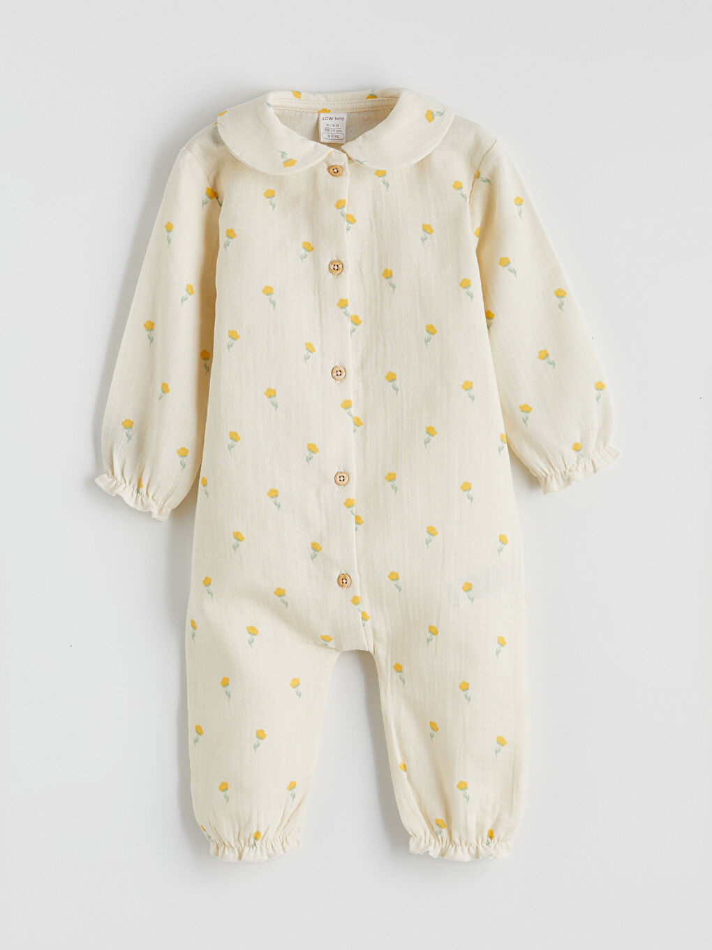 Ekru Fırfırlı Çiçek Baskılı Müslin Kız Bebek Tulum