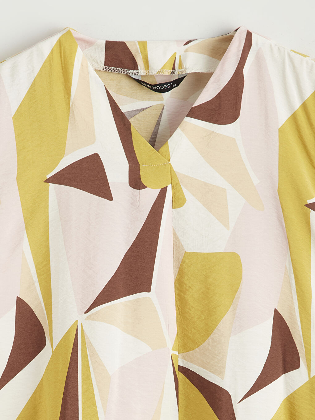 بلوزة واسعة منقوشة بياقة على شكل حرف V-9