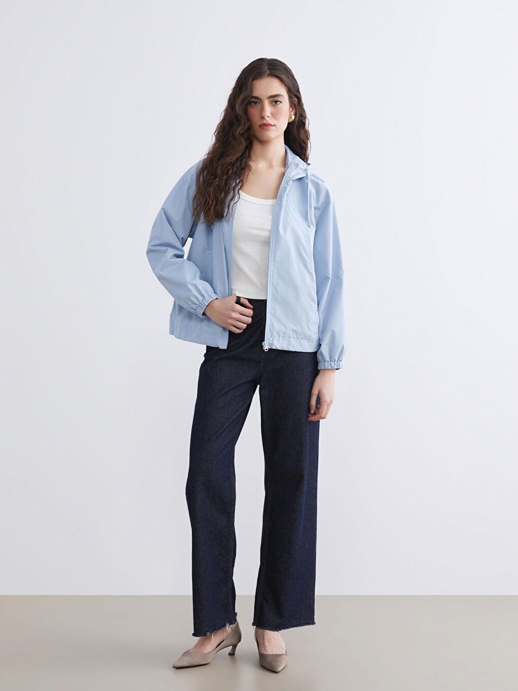 Oversized hooded raincoat for women.-1