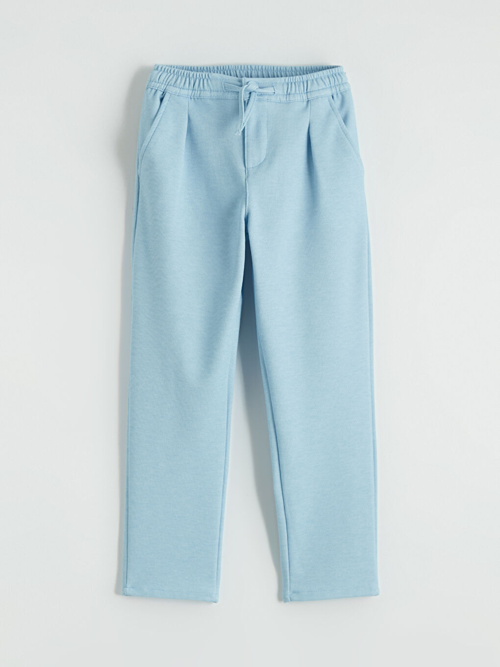 Boys' pleated trousers with elasticated waistband.