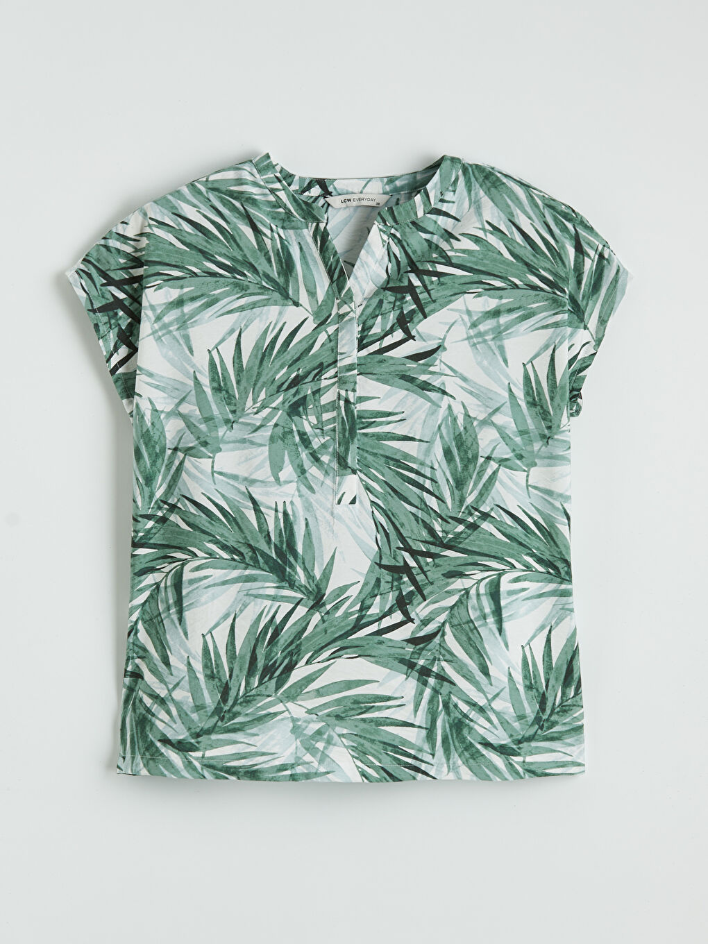 ქალი მწვანე ბლუზი-4