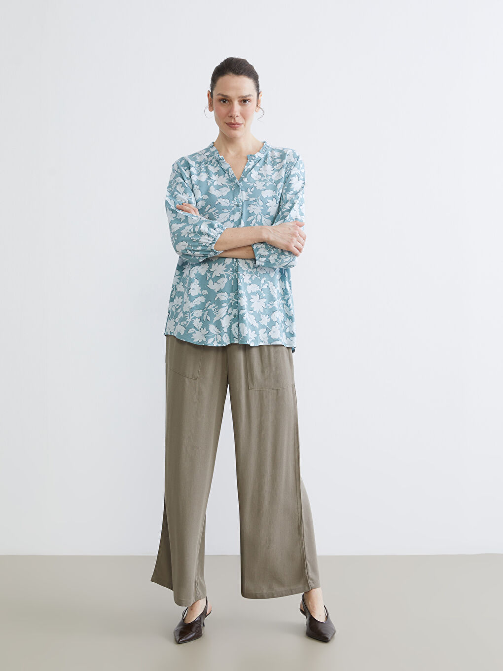 Floral blouse with an asymmetrical neckline.-1