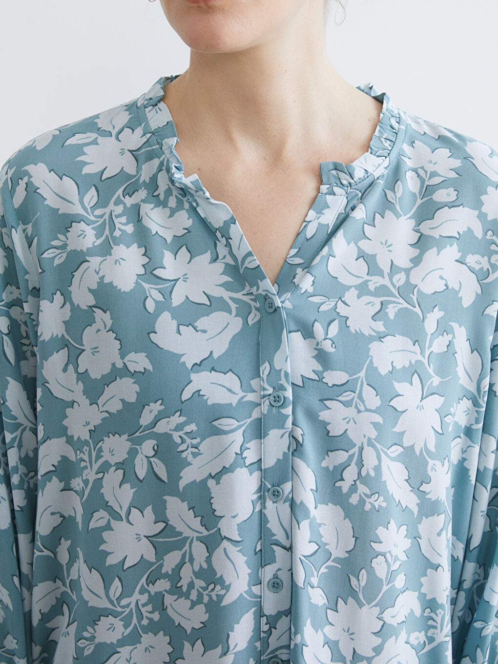 Floral blouse with an asymmetrical neckline.-2