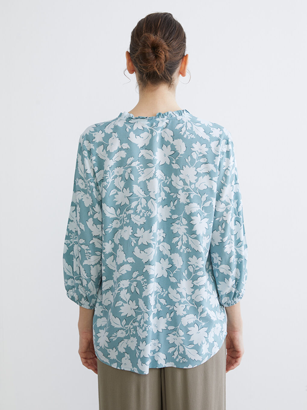 Floral blouse with an asymmetrical neckline.-3