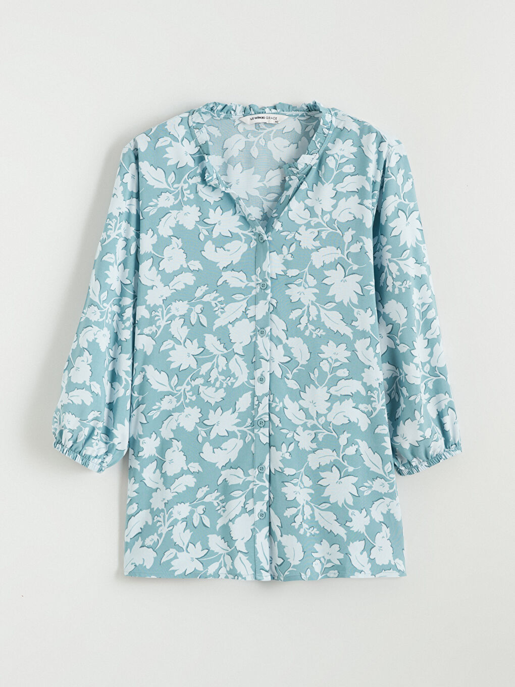 Floral blouse with an asymmetrical neckline.-4