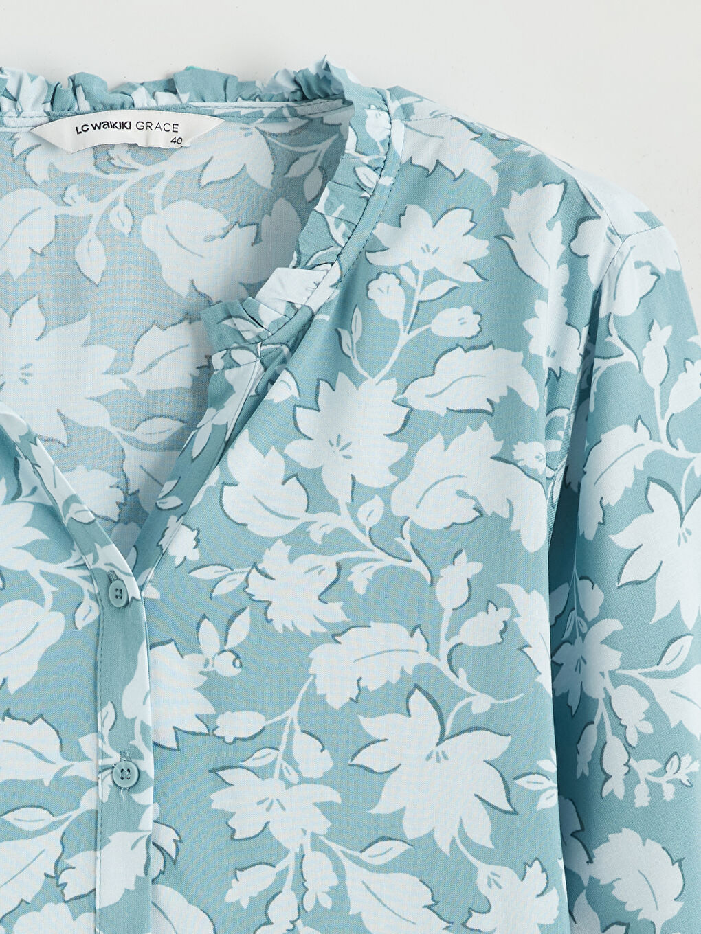 Floral blouse with an asymmetrical neckline.-5