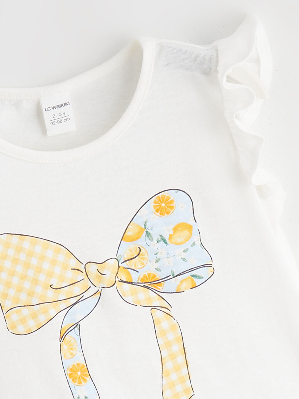 Dečija majica sa volanima i printom mašne-1