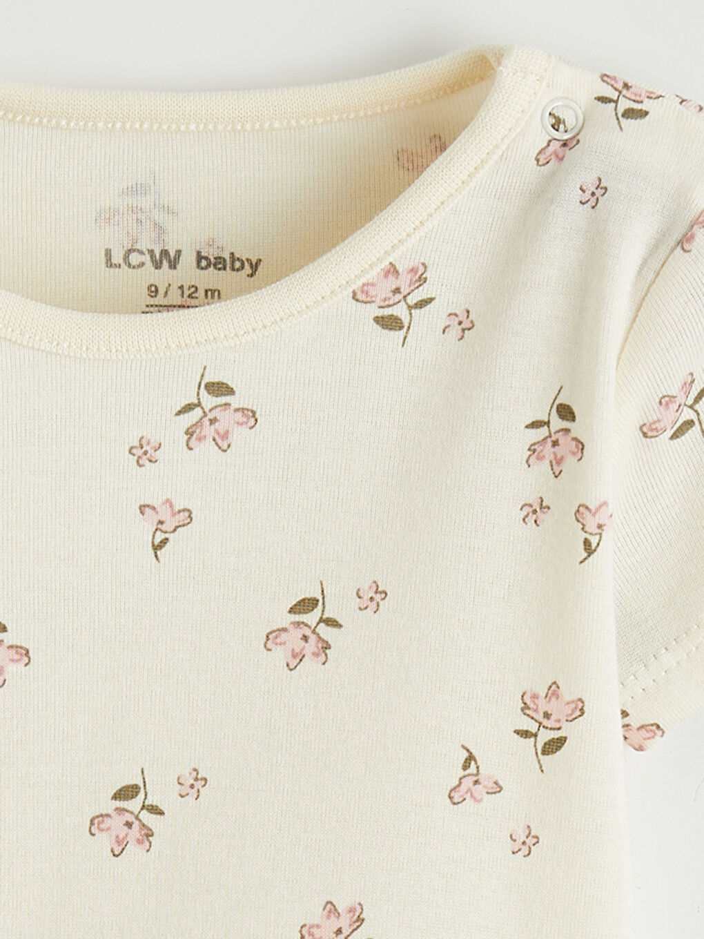 Two-piece snap-closure bodysuit set for baby girls with a crew neck.-1