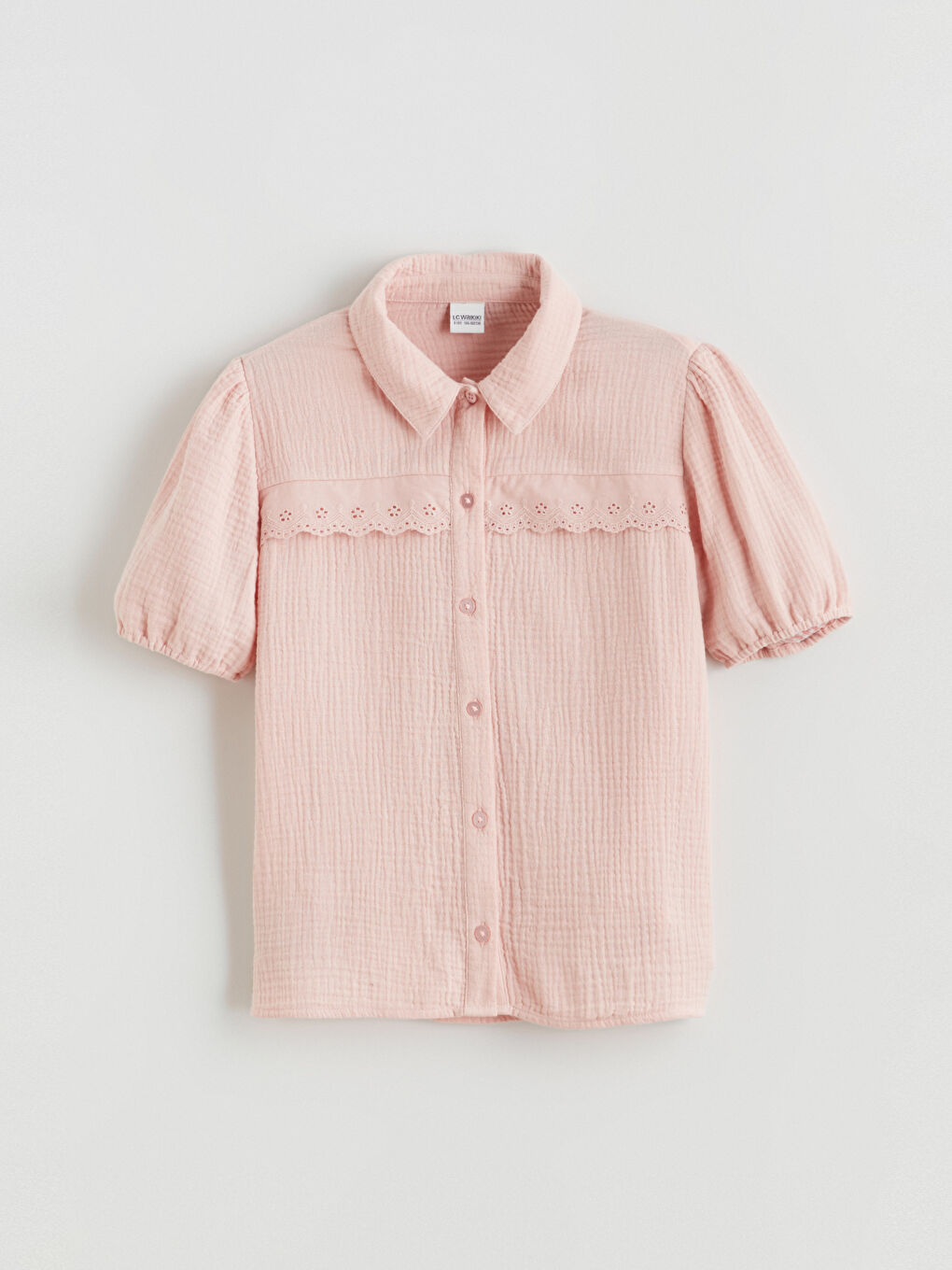 Girls' muslin shirt with eyelet detailing.