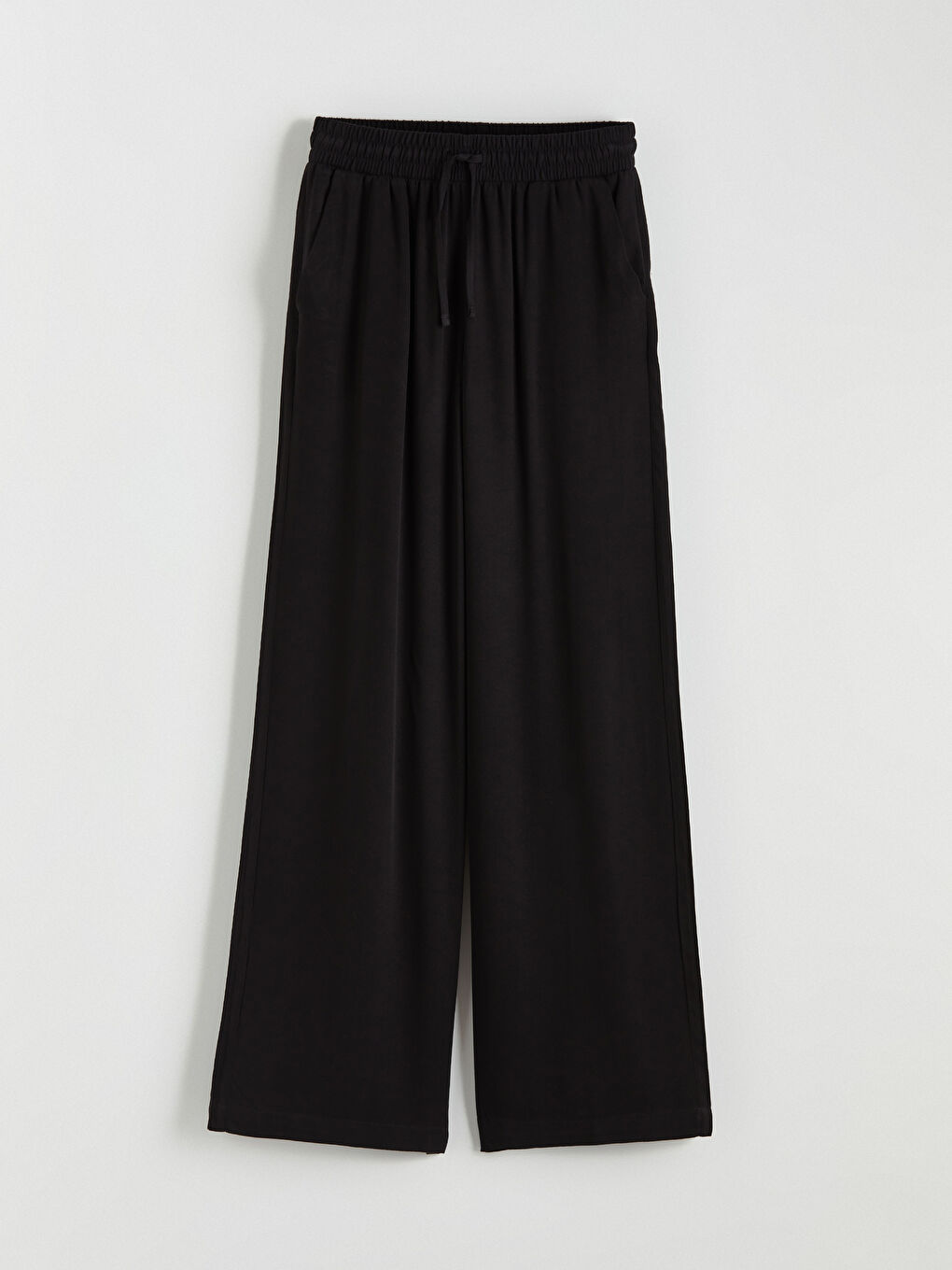 Effortless elegance meets everyday comfort in our wide-leg trousers with an elasticated waist.-4