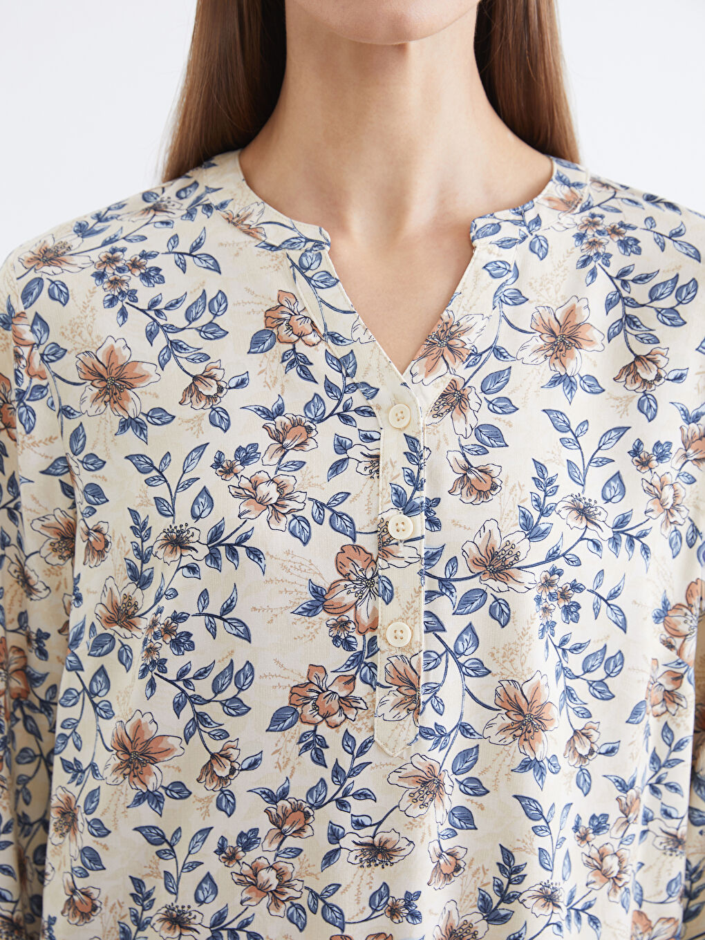 Floral blouse with an asymmetrical neckline.-2