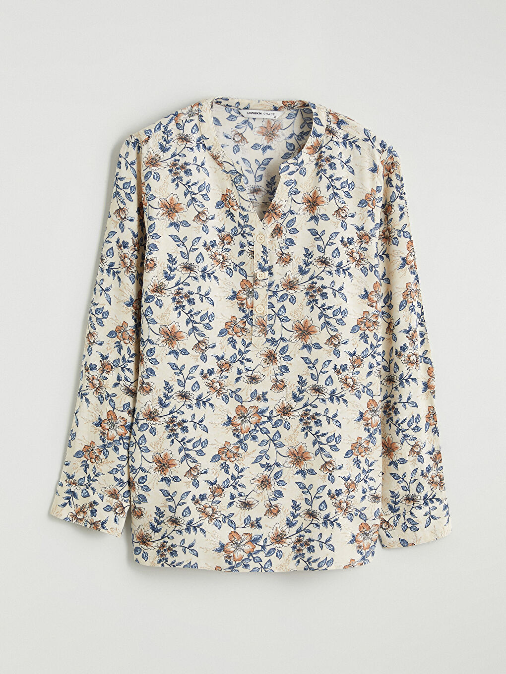 Floral blouse with an asymmetrical neckline.-4