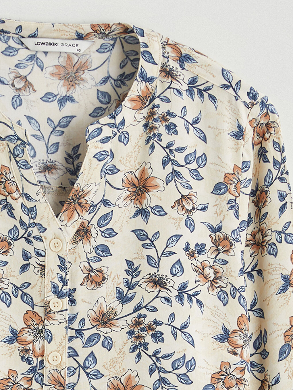 Floral blouse with an asymmetrical neckline.-5