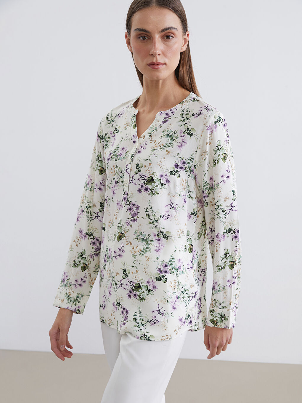 Floral blouse with an asymmetrical neckline.