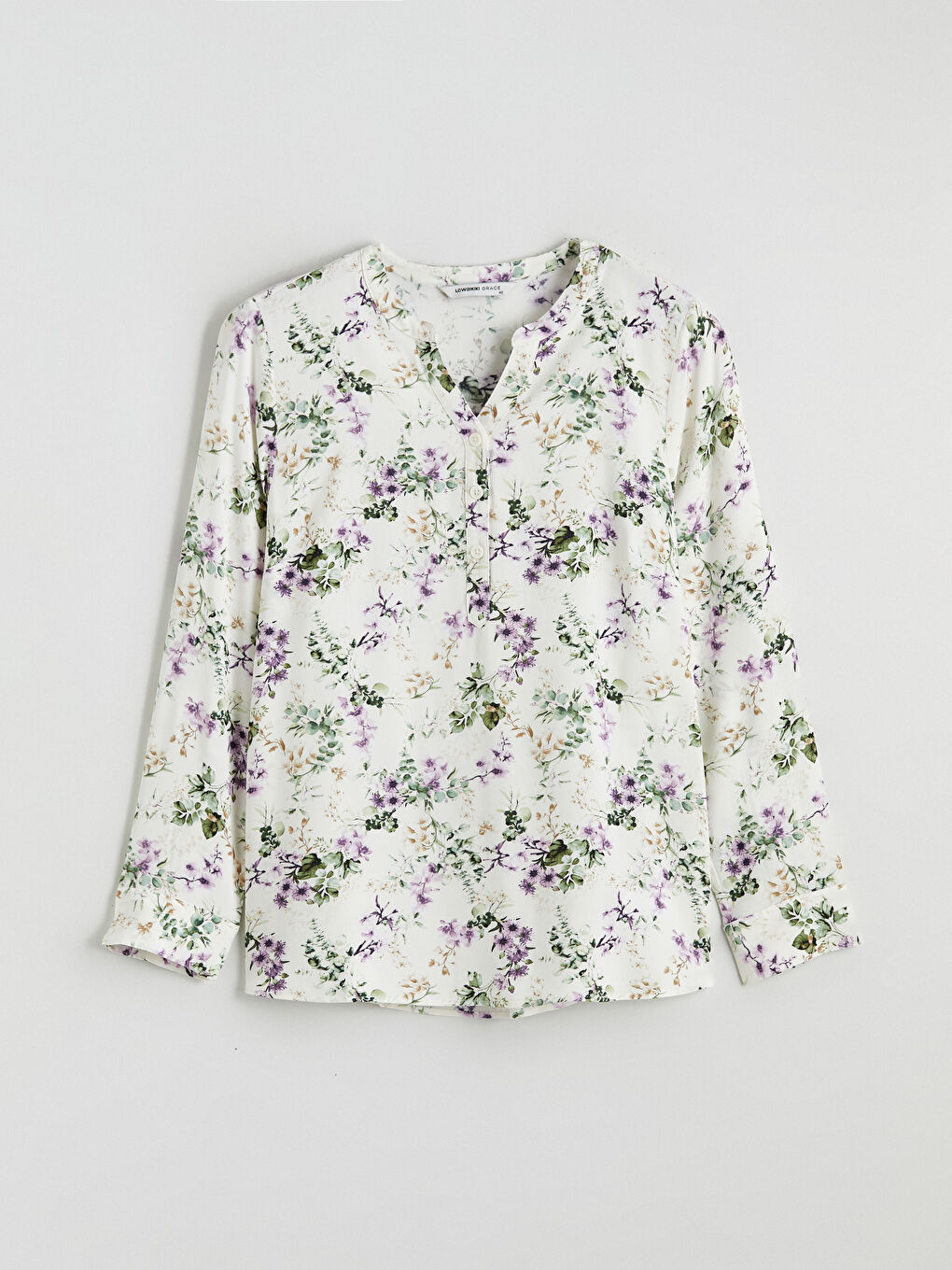 Floral blouse with an asymmetrical neckline.-4