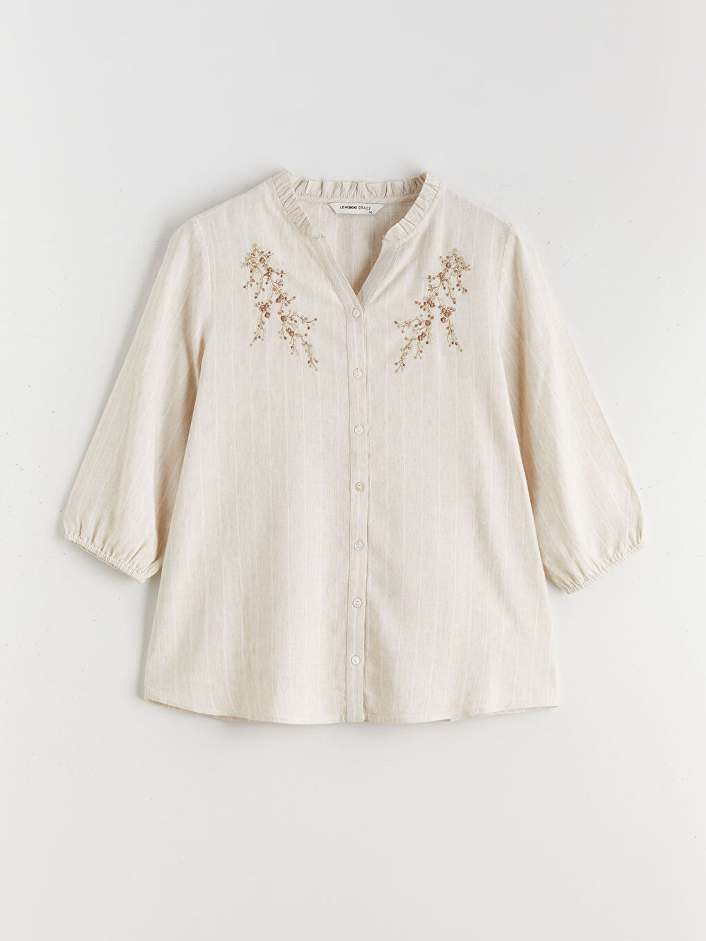 Striped linen-blend blouse with a unique neckline.-2