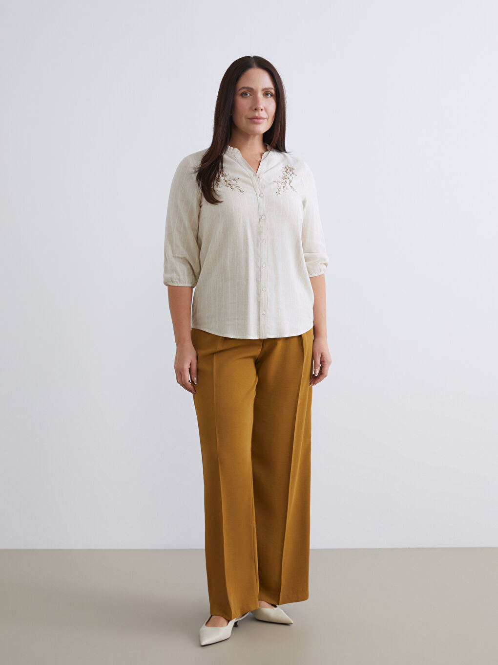 Striped linen-blend blouse with a unique neckline.-1