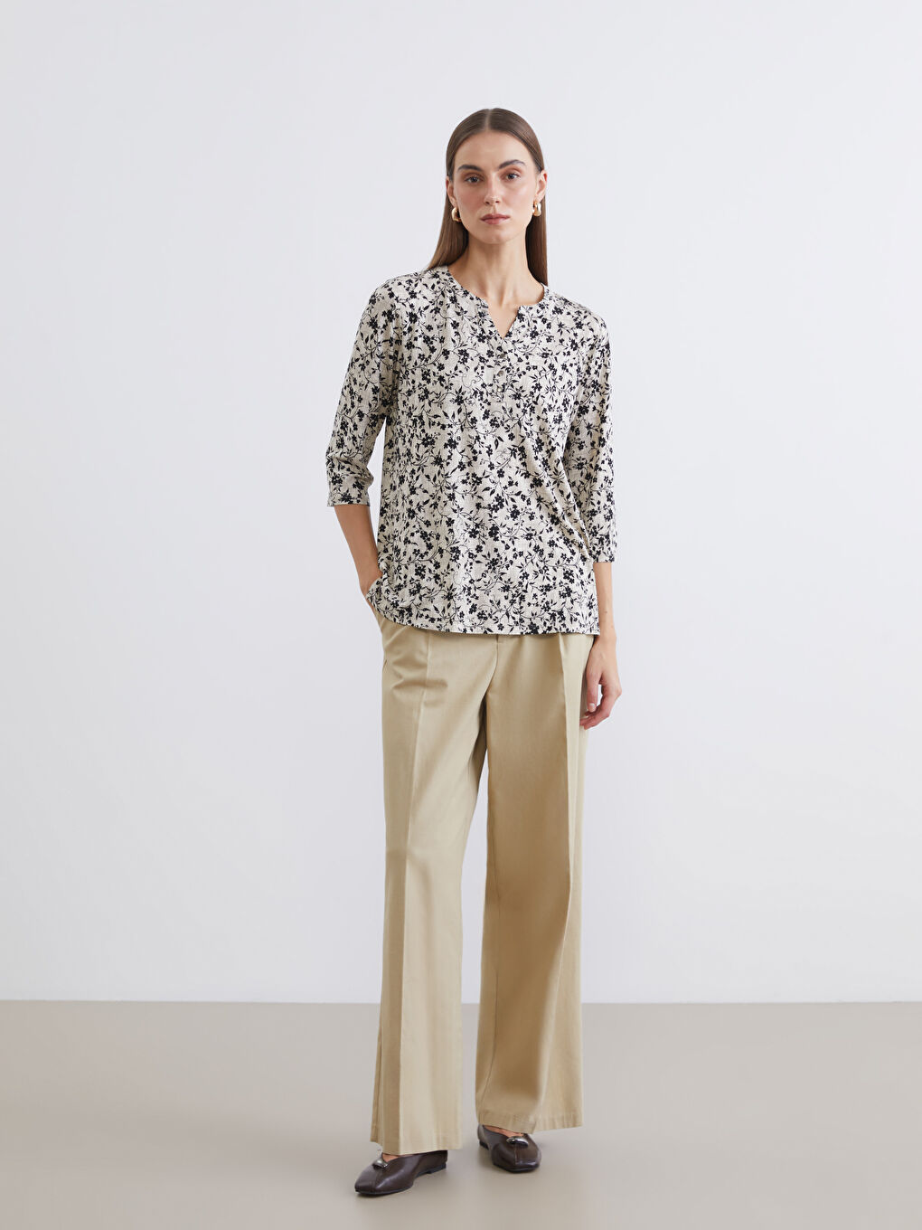 Floral blouse with an asymmetrical neckline.-1