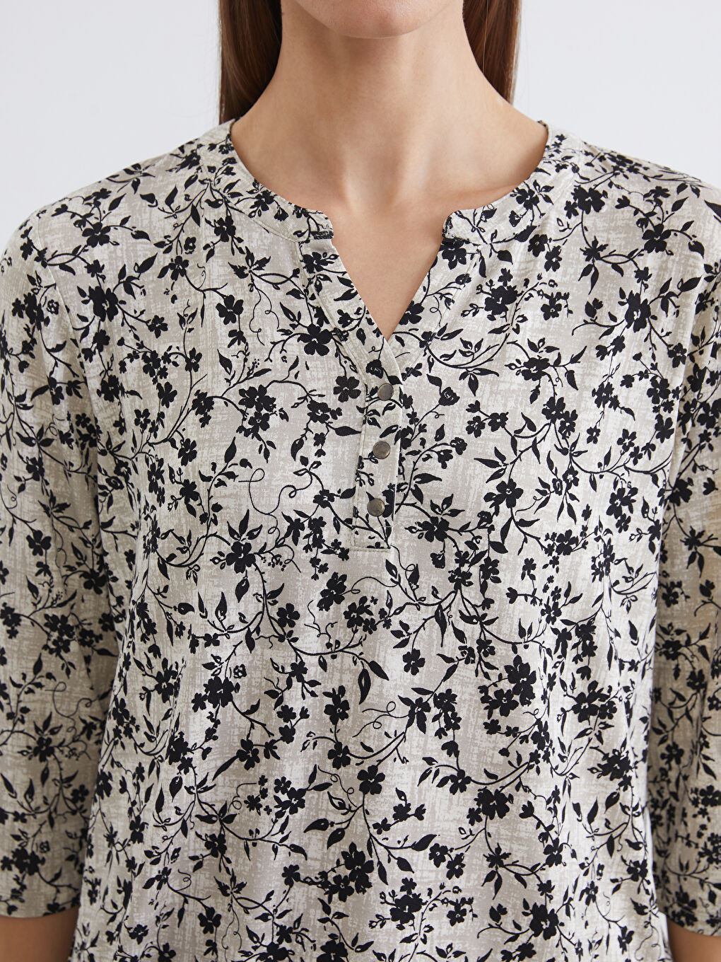 Floral blouse with an asymmetrical neckline.-2