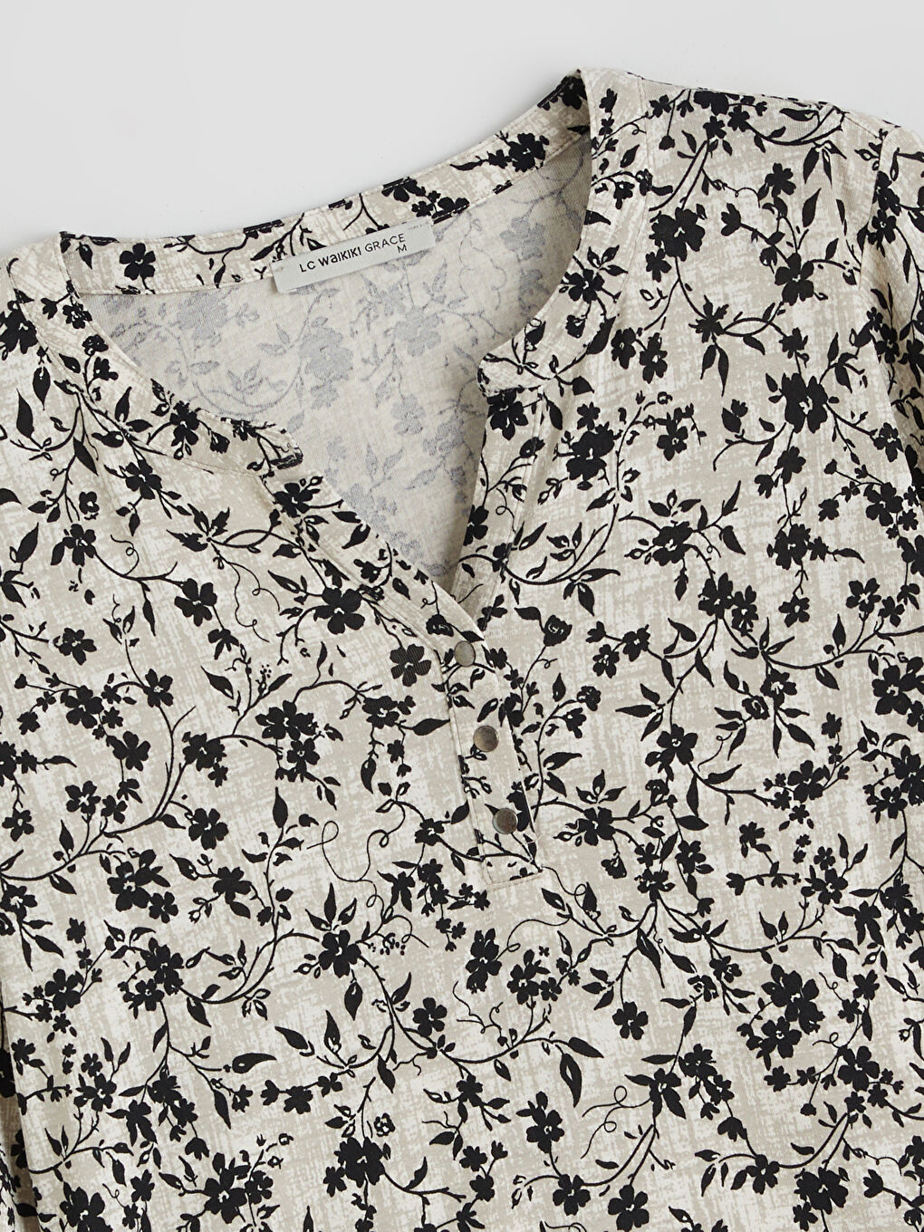 Floral blouse with an asymmetrical neckline.-5