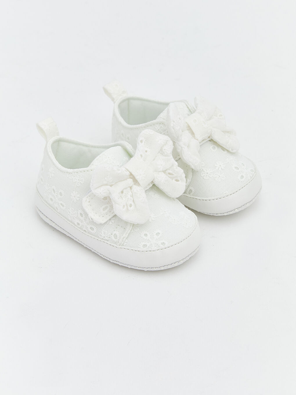 Baby girl's first walking shoes with bow detail.
