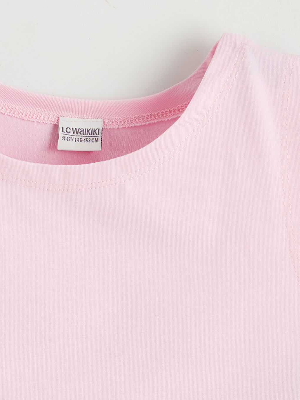 تيشيرت رياضي بناتي بياقة دائرية-1