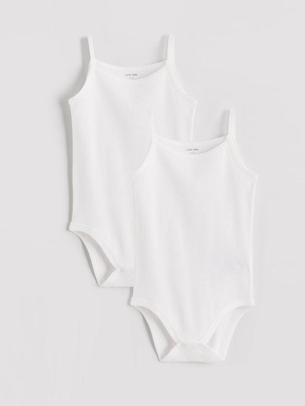 Two-piece basic baby girl snap-closure bodysuit set.